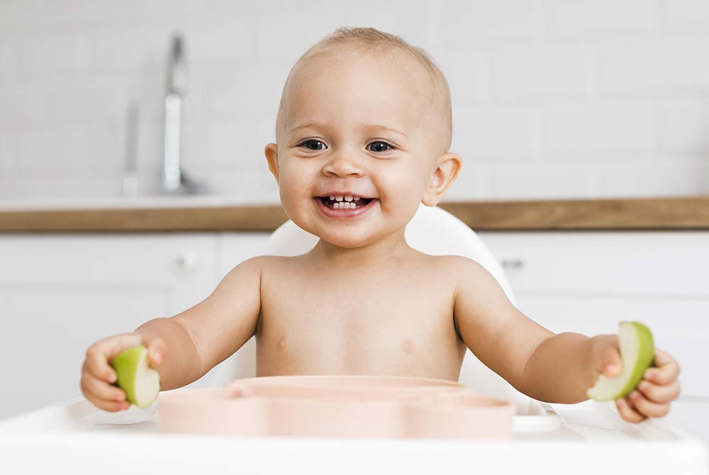 Happy Child with First Tooth