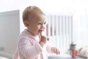 Happy Child with First Tooth